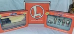 Lionel Gauge Figures Christmas Pack 6-14259 & 6-24193 Blinking Lot Billboard. Fixed Price $59.99.