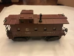 Lionel Lighted Caboose 6457 Brown W/ Black Stack. Fixed Price $16.99.