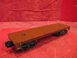 Lionel #1877-3 Gauge Postwar Brown Flat Car. Fixed Price $14.95.