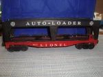 Vintage 1959-60 Lionel 6821 Red Flat Car W/ Blk Metal Auto Loader Rack. Fixed Price $40.00.
