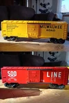 2 Box Cars - Lionel Gauge Milwaukee Road Yellow & Soo Line Red. Fixed Price $27.00.