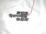 Lionel Die-cast 6 Wheel Truck With Collector, Ground And Operating Coupler. Fixed Price $44.00.