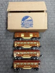 + Early Mth Gauge Tinplate Terra Cotta & Maroon 4 Car 600 Series Passenger Set. Fixed Price $475.00.