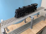 Trestles For Elevated Train Gauge Lionel Fastrack - Package Of 3 Light Gray. Fixed Price $30.00.