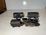 Early American Flyer #10 Wind Up Cast Iron Locomotive, 1107 Coach, 1108 Baggage. Fixed Price $135.00.