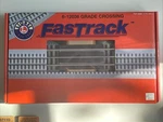 Lionel Fastrack Grade Crossing Includes Sections #6-12036. Fixed Price $14.95.