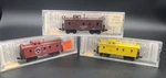 3 New- Scale Kadee Micro Trains Mtl 50100(UP)/50040(ATSF)/50090(GN) Cabooses. Fixed Price $90.00.